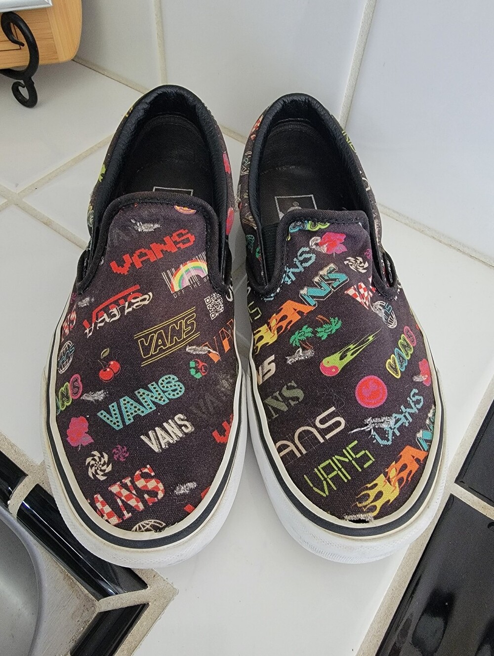 Vans Black Slip-On Sneakers with Multicolor Logo Print Unisex